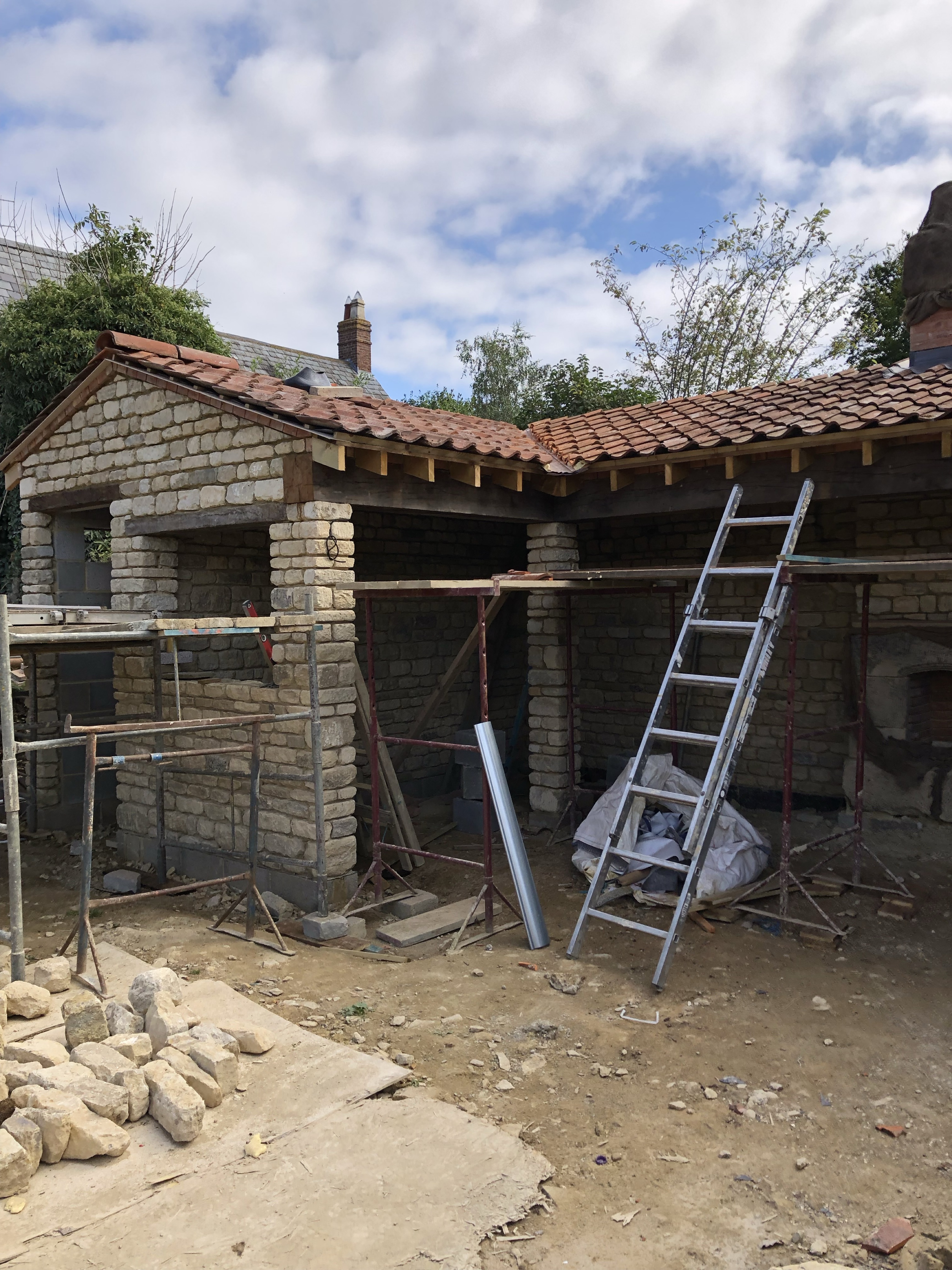 Stone building restoration and roof construction